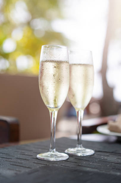 Two glasses of champagne in a restaurant on the coast of a resort in the Maldives.